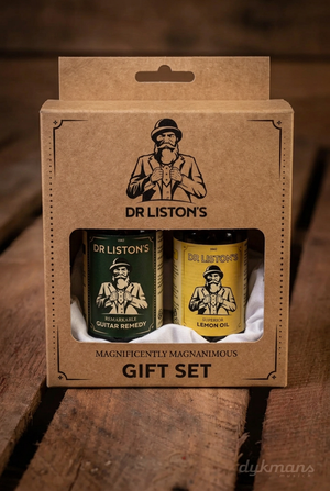 Dr. Liston's Guitar Remedy & Lemon Oil Set op een warme houten achtergrond